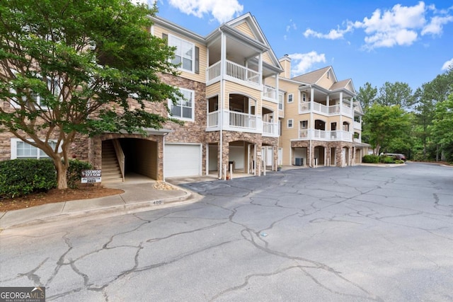 426 Pembrooke Cir Unit 426, Alpharetta, GA 30004 - view of apartment building / complex with driveway and an attached garage