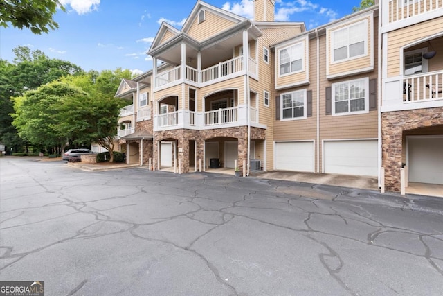426 Pembrooke Cir Unit 426, Alpharetta, GA 30004 - view of property featuring an attached garage and driveway
