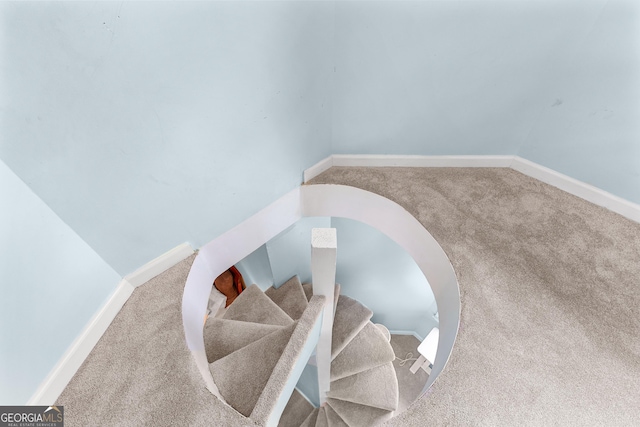 stairs with carpet flooring and baseboards