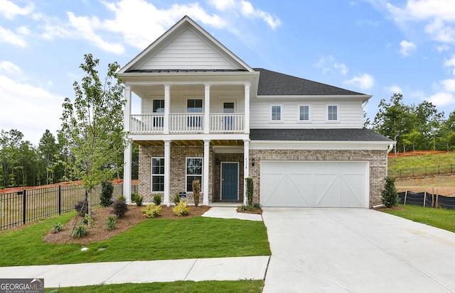 4297 Azalea Ridge Way, Hoschton, GA 30548 - greek revival inspired property featuring a balcony, concrete driveway, a garage, brick siding, and roof with shingles