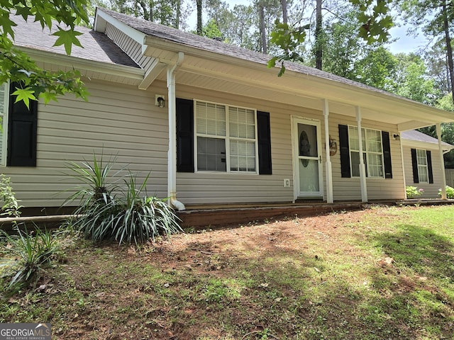 ranch-style house featuring covered porch