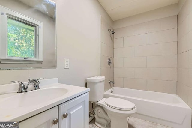 bathroom with toilet, vanity, and  shower combination