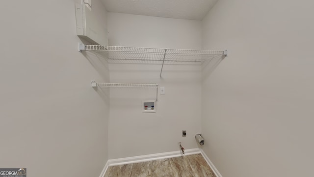 200 Compton Ct, Mcdonough, GA 30252 - laundry room with washer hookup, wood finished floors, baseboards, and hookup for an electric dryer
