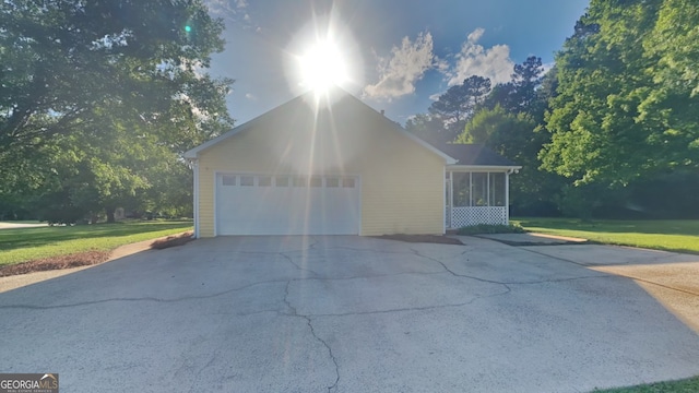 200 Compton Ct, Mcdonough, GA 30252 - view of home's exterior featuring concrete driveway, a yard, and a sunroom