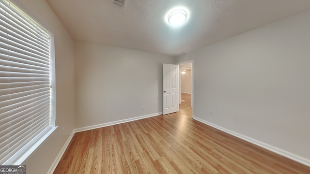 200 Compton Ct, Mcdonough, GA 30252 - spare room featuring light wood-style flooring and baseboards