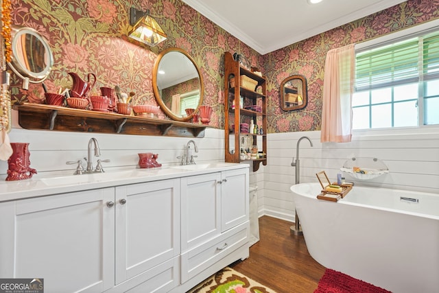 3839 Brookcrest Cir, Decatur, GA 30032 - full bath with wallpapered walls, crown molding, double vanity, wood finished floors, and a freestanding tub