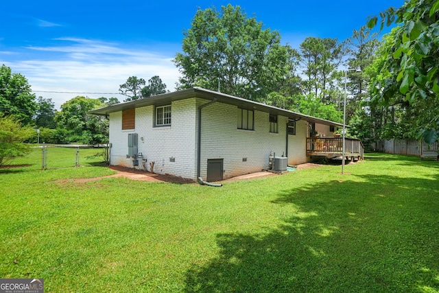 3839 Brookcrest Cir, Decatur, GA 30032 - back of property featuring a fenced backyard, brick siding, and a wooden deck