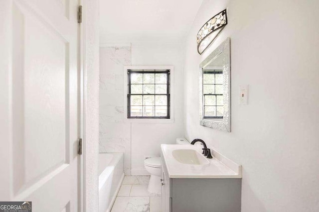 bathroom featuring toilet, marble finish flooring, and vanity
