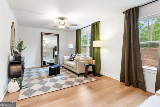 3390 Traditions Way, Jefferson, GA 30549 - living area featuring a ceiling fan, light wood finished floors, and baseboards