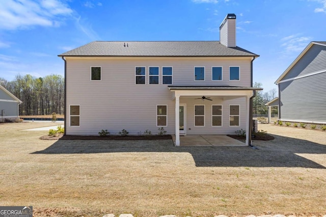 3390 Traditions Way, Jefferson, GA 30549 - back of property featuring ceiling fan, a patio area, a chimney, and a lawn