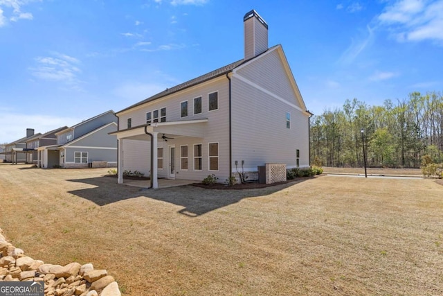 3390 Traditions Way, Jefferson, GA 30549 - back of property featuring ceiling fan, a lawn, a patio, and a chimney
