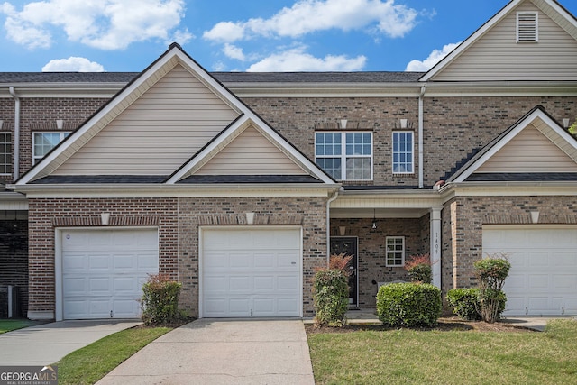 2555 Flat Shoals Rd Unit 1405, College Park, GA 30349 - traditional home featuring brick siding, concrete driveway, and a garage