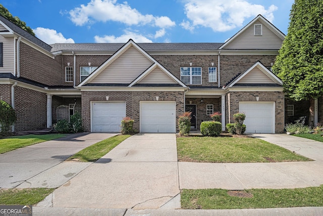 2555 Flat Shoals Rd Unit 1405, College Park, GA 30349 - view of front facade featuring brick siding, driveway, and a front lawn