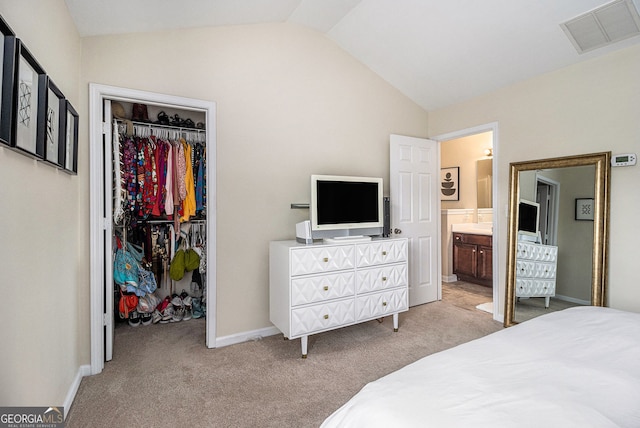 2555 Flat Shoals Rd Unit 1405, College Park, GA 30349 - carpeted bedroom featuring a walk in closet, lofted ceiling, a closet, ensuite bathroom, and baseboards