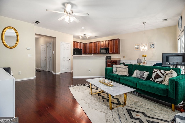 2555 Flat Shoals Rd Unit 1405, College Park, GA 30349 - living room featuring a chandelier, a ceiling fan, dark wood-style flooring, and baseboards