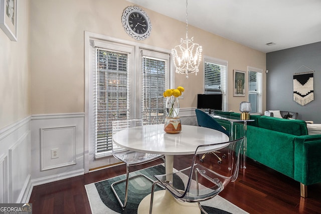 2555 Flat Shoals Rd Unit 1405, College Park, GA 30349 - dining room with wood finished floors, wainscoting, and a chandelier