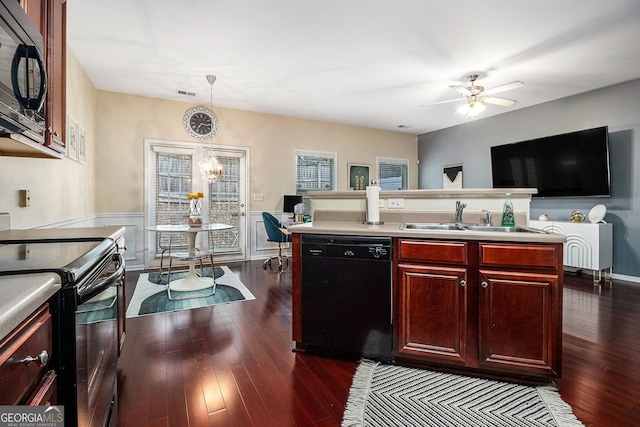 2555 Flat Shoals Rd Unit 1405, College Park, GA 30349 - kitchen with black appliances, reddish brown cabinets, a sink, dark wood finished floors, and a ceiling fan