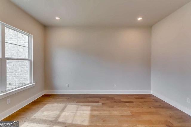 3354 Traditions Way, Jefferson, GA 30549 - unfurnished room with healthy amount of natural light, light wood-style flooring, baseboards, and recessed lighting