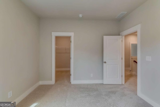 3354 Traditions Way, Jefferson, GA 30549 - unfurnished bedroom featuring carpet flooring, a walk in closet, baseboards, and a closet