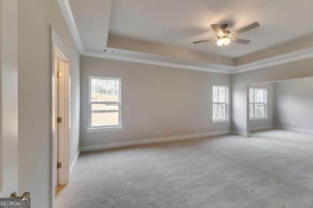 3354 Traditions Way, Jefferson, GA 30549 - unfurnished room featuring a tray ceiling, light carpet, baseboards, and a ceiling fan