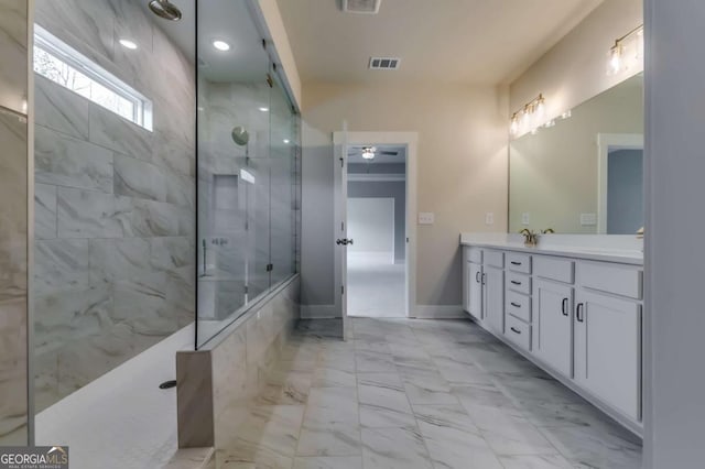 3354 Traditions Way, Jefferson, GA 30549 - bathroom with marble look tile flooring, a walk in shower, vanity, ceiling fan, and baseboards