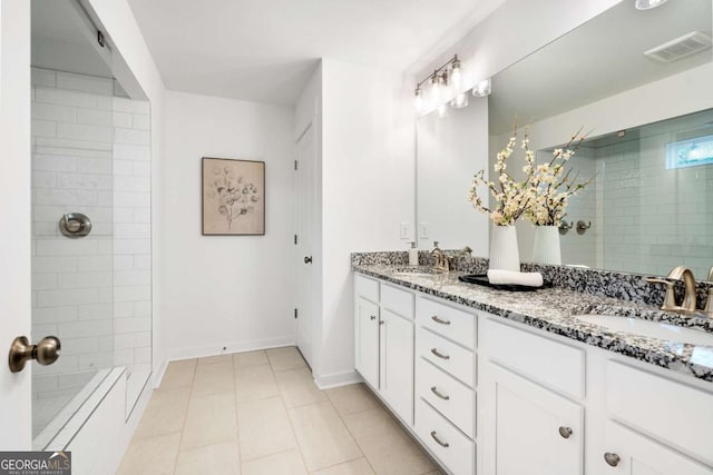 3354 Traditions Way, Jefferson, GA 30549 - full bath featuring a tile shower, tile patterned floors, double vanity, and baseboards
