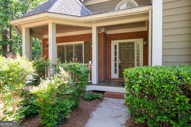 4711 Oakleigh Manor Dr, Powder Springs, GA 30127 - entrance to property featuring a porch, brick siding, and a shingled roof