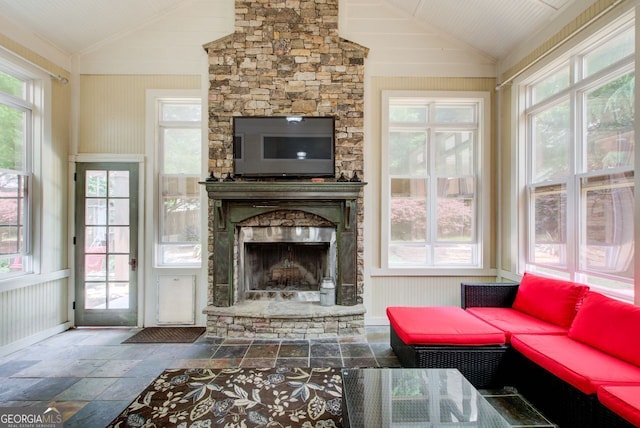 5220 Wild Cedar Dr, Buford, GA 30518 - living area featuring lofted ceiling, stone tile flooring, and a stone fireplace