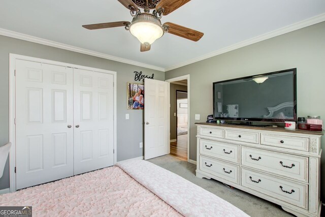 5220 Wild Cedar Dr, Buford, GA 30518 - bedroom with light colored carpet, ornamental molding, a closet, a ceiling fan, and baseboards
