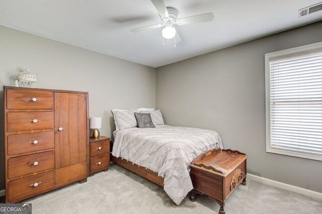 5220 Wild Cedar Dr, Buford, GA 30518 - bedroom with light carpet, multiple windows, baseboards, and ceiling fan