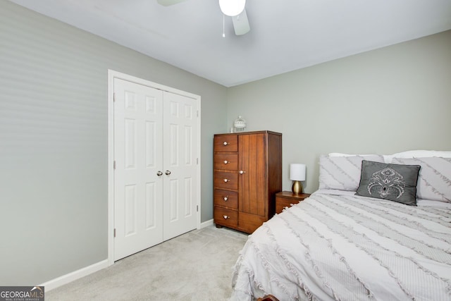 5220 Wild Cedar Dr, Buford, GA 30518 - bedroom with light carpet, a closet, baseboards, and ceiling fan
