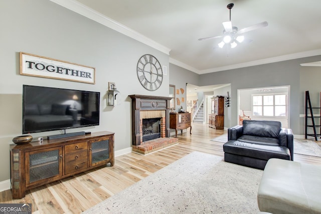 5220 Wild Cedar Dr, Buford, GA 30518 - living room with stairway, a fireplace, a ceiling fan, wood finished floors, and ornamental molding