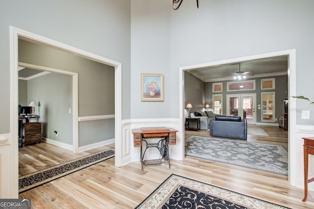 5220 Wild Cedar Dr, Buford, GA 30518 - entrance foyer with wood finished floors, a towering ceiling, crown molding, french doors, and a ceiling fan