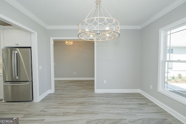 137 Amanda Trce, Kingsland, GA 31548 - unfurnished dining area with a chandelier, ornamental molding, and baseboards