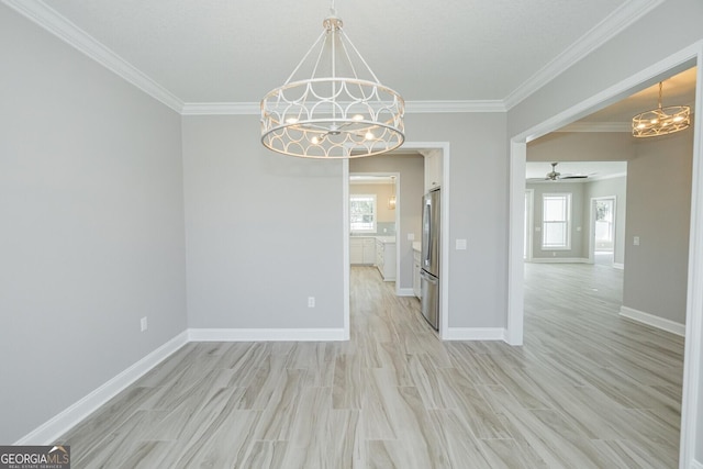 137 Amanda Trce, Kingsland, GA 31548 - empty room featuring a chandelier, ornamental molding, light wood-type flooring, baseboards, and ceiling fan