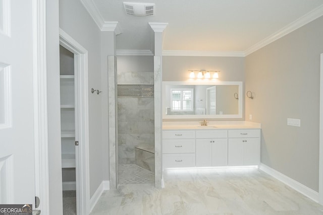 137 Amanda Trce, Kingsland, GA 31548 - bathroom featuring crown molding, marble finish flooring, a walk in shower, a spacious closet, and baseboards