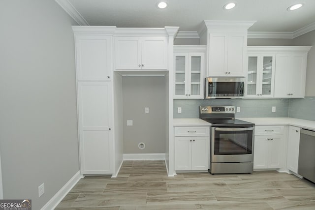 137 Amanda Trce, Kingsland, GA 31548 - kitchen with stainless steel appliances, white cabinets, crown molding, glass insert cabinets, and recessed lighting