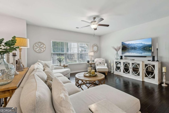 living area with wood finished floors, ceiling fan, and baseboards