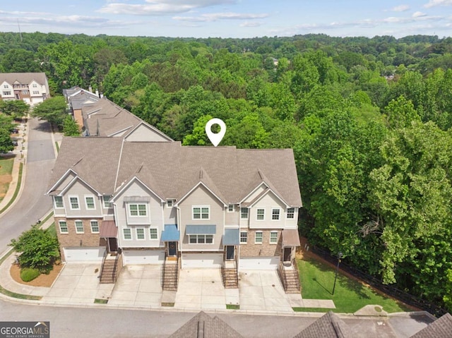 view from above of property featuring a forest