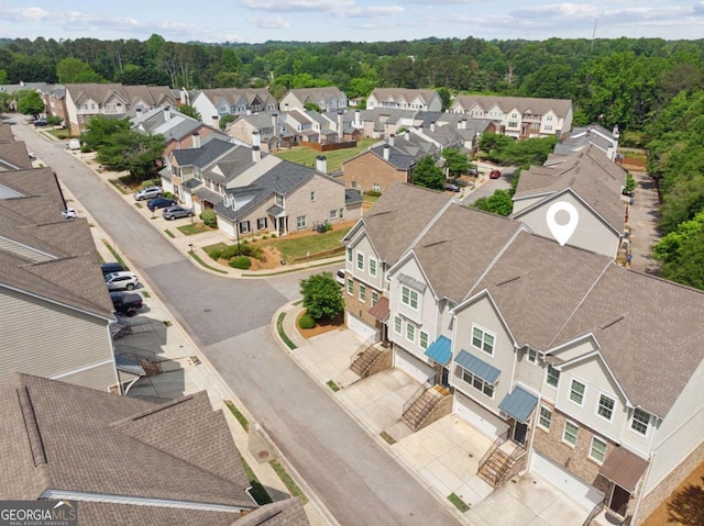 aerial perspective of suburban area featuring a forest