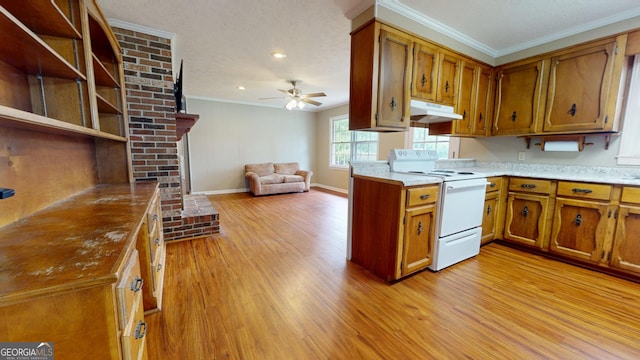 304 5th Ave, Twin City, GA 30471 - kitchen featuring white electric range, under cabinet range hood, brown cabinetry, light wood-style flooring, and ornamental molding