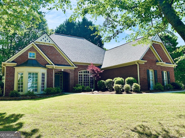 6605 New Ridge Ct, Cumming, GA 30041 - view of front of property featuring a front lawn, brick siding, and a shingled roof