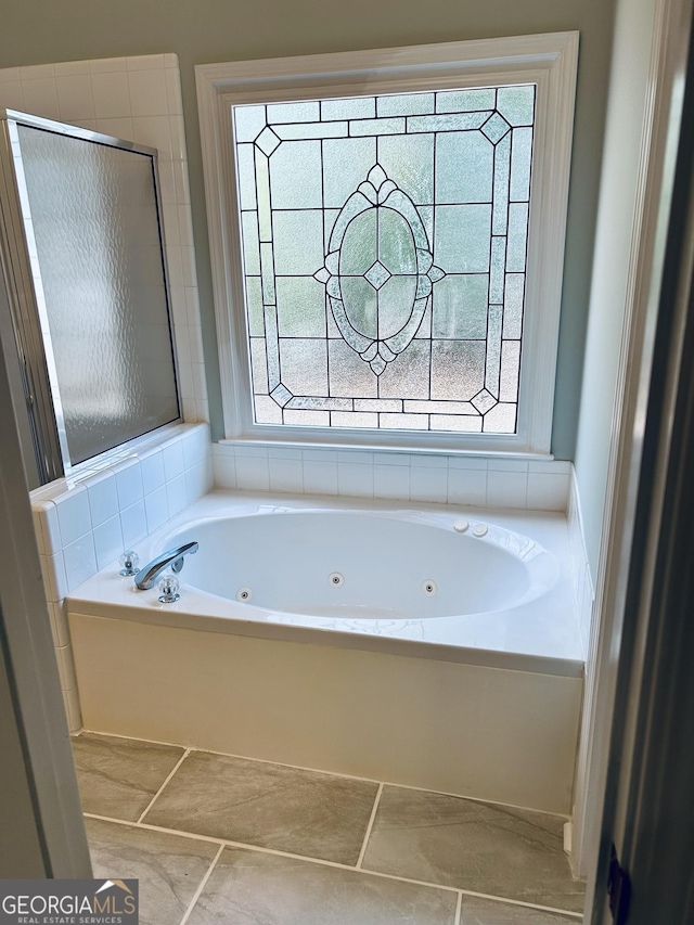 6605 New Ridge Ct, Cumming, GA 30041 - full bath with plenty of natural light, a jetted tub, and a shower stall