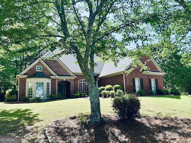 6605 New Ridge Ct, Cumming, GA 30041 - view of front facade featuring a front lawn, brick siding, and a shingled roof