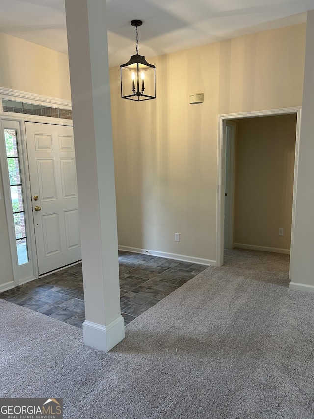 6605 New Ridge Ct, Cumming, GA 30041 - foyer featuring carpet floors, a chandelier, and baseboards