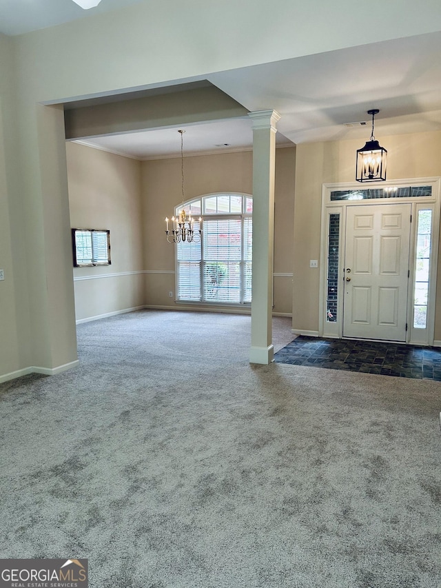 6605 New Ridge Ct, Cumming, GA 30041 - carpeted foyer featuring a chandelier and baseboards