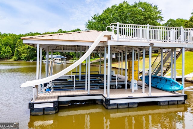 dock area featuring boat lift, a water view, and stairs