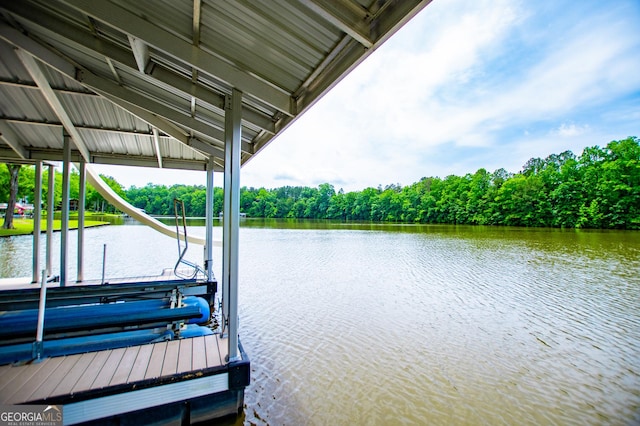 dock featuring boat lift and a water view