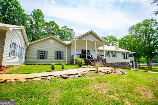 ranch-style home featuring a front yard and board and batten siding