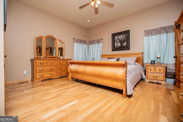 bedroom with light wood-style floors, a ceiling fan, and recessed lighting